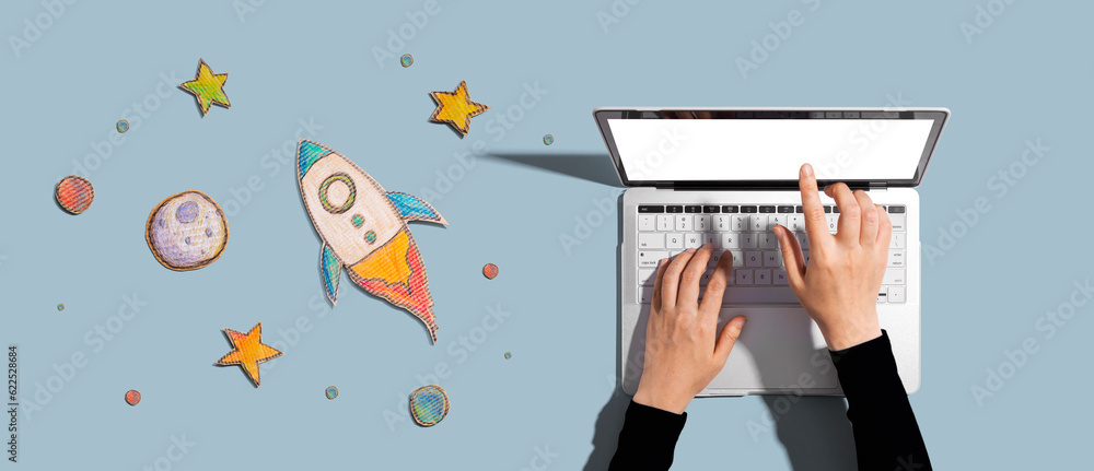 Space exploration theme with a rocket and a laptop