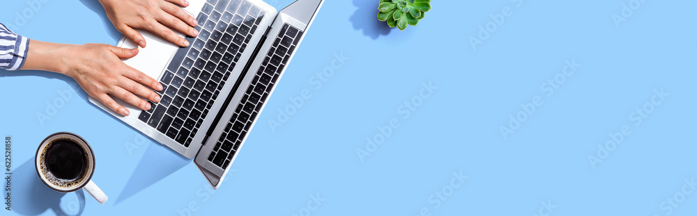 Person using a laptop computer from above