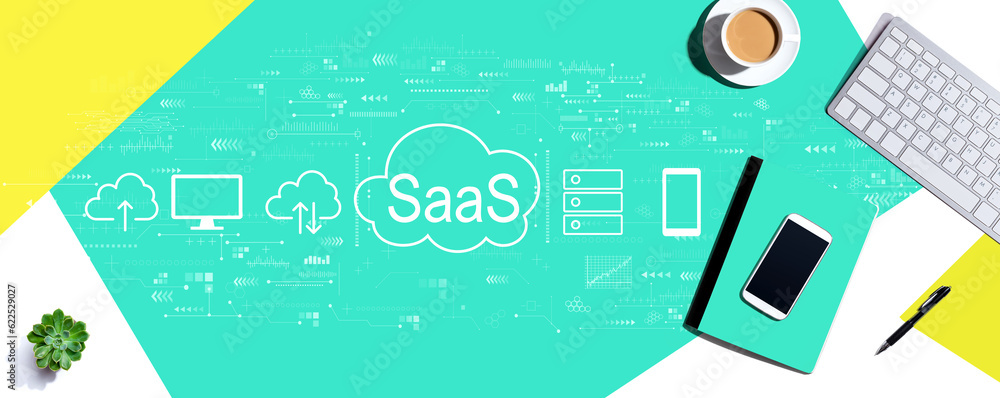 SaaS - software as a service concept with a computer keyboard and office items