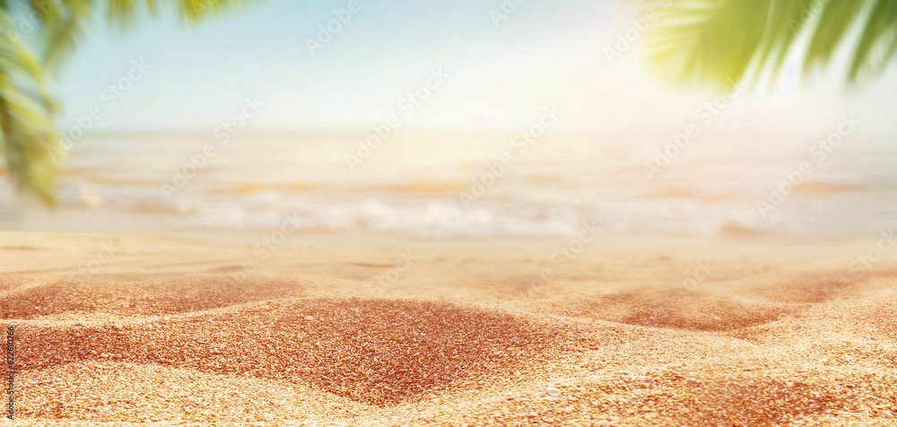 Beautiful background for summer vacation and travel. Golden sand of tropical beach, blurry palm leav