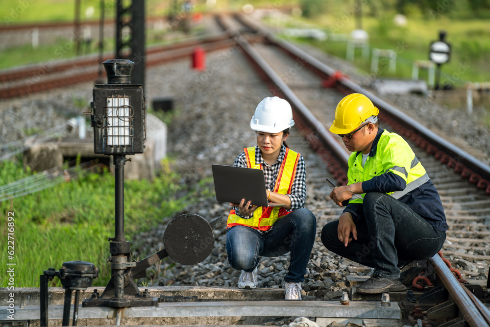 Architects and engineers use laptop technology and construction innovations to inspect the train tra