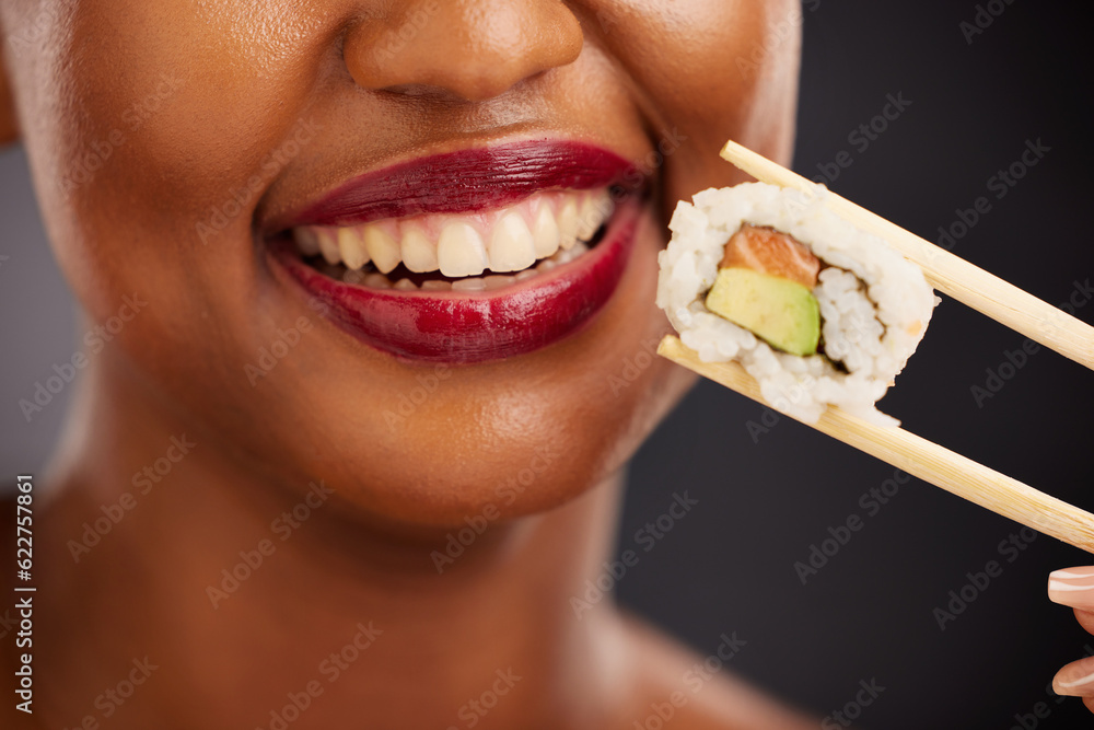 Mouth, eating and woman with sushi and chopsticks in studio for healthy food or teeth. Black female 