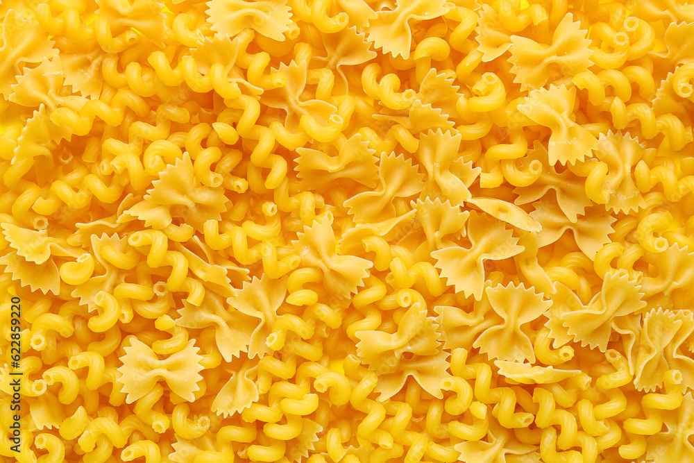 Raw farfale and cavatappi pasta as background, closeup