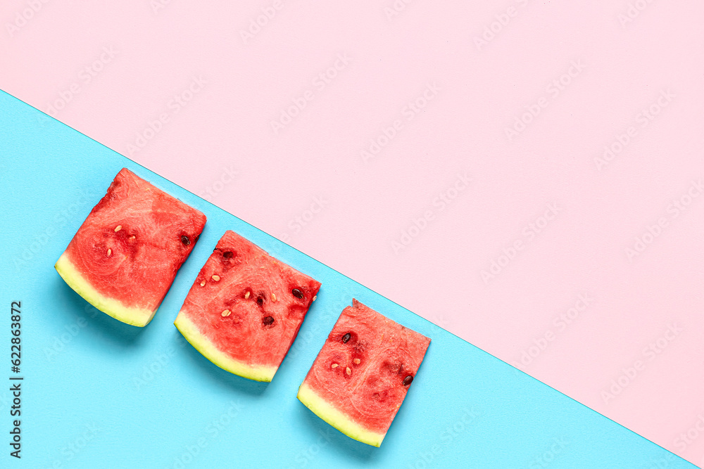 Pieces of fresh watermelon on colorful background