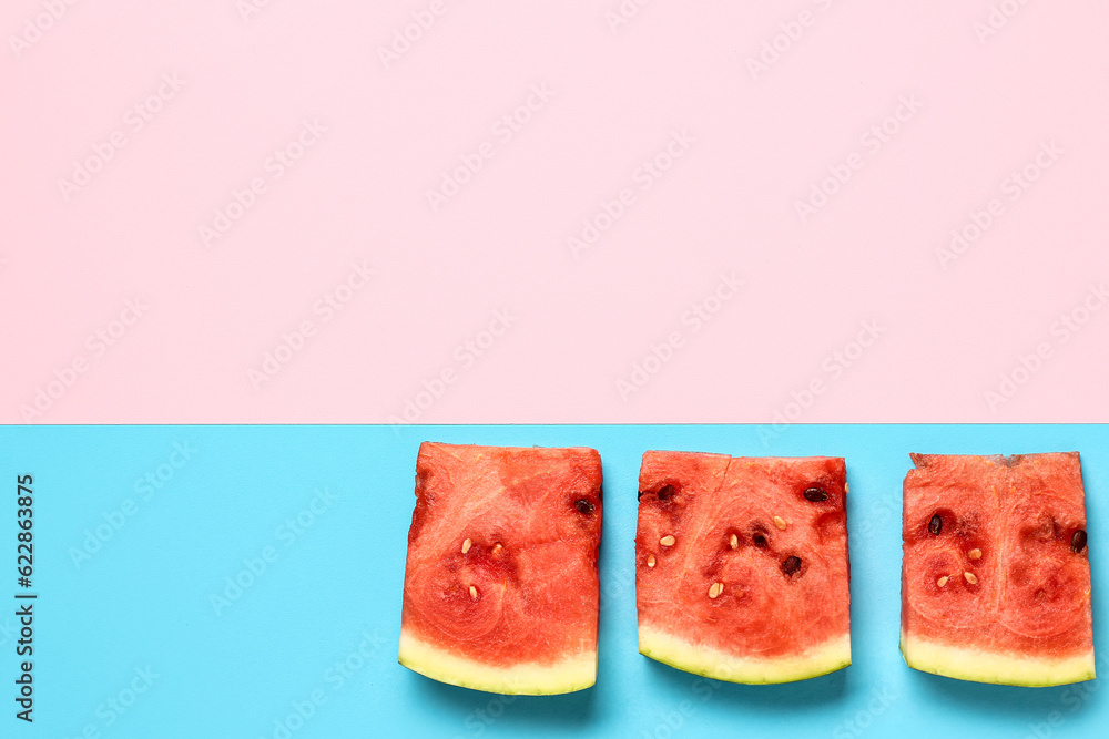 Pieces of fresh watermelon on colorful background