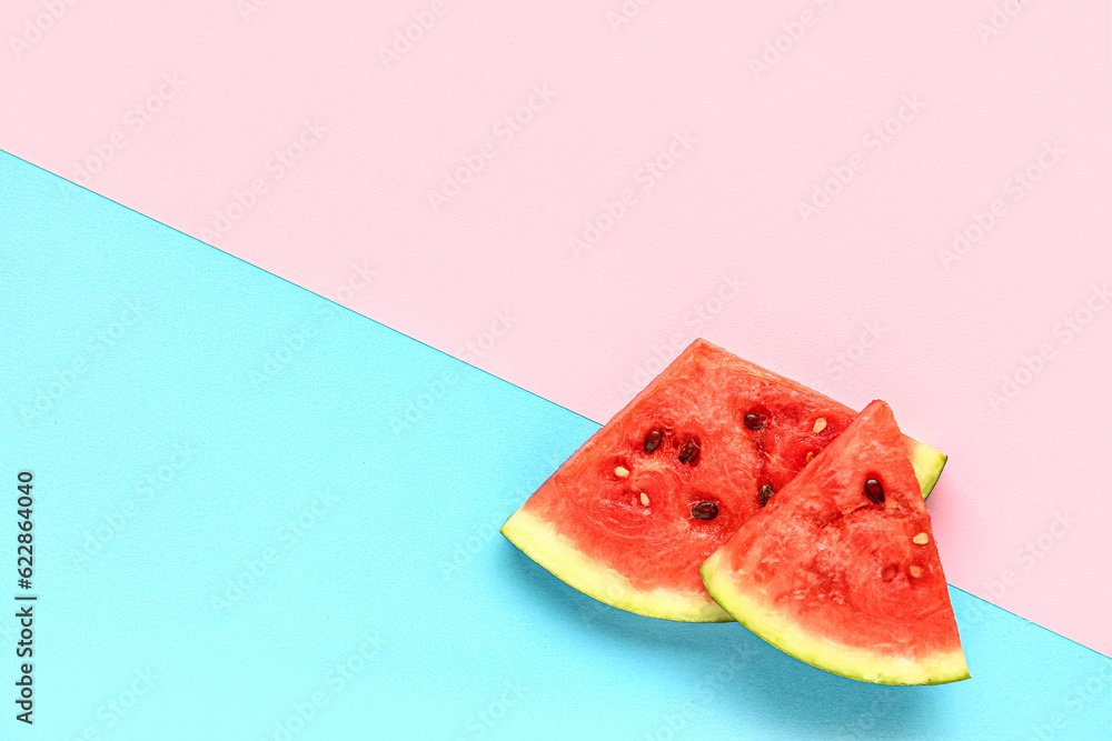 Pieces of fresh watermelon on colorful background