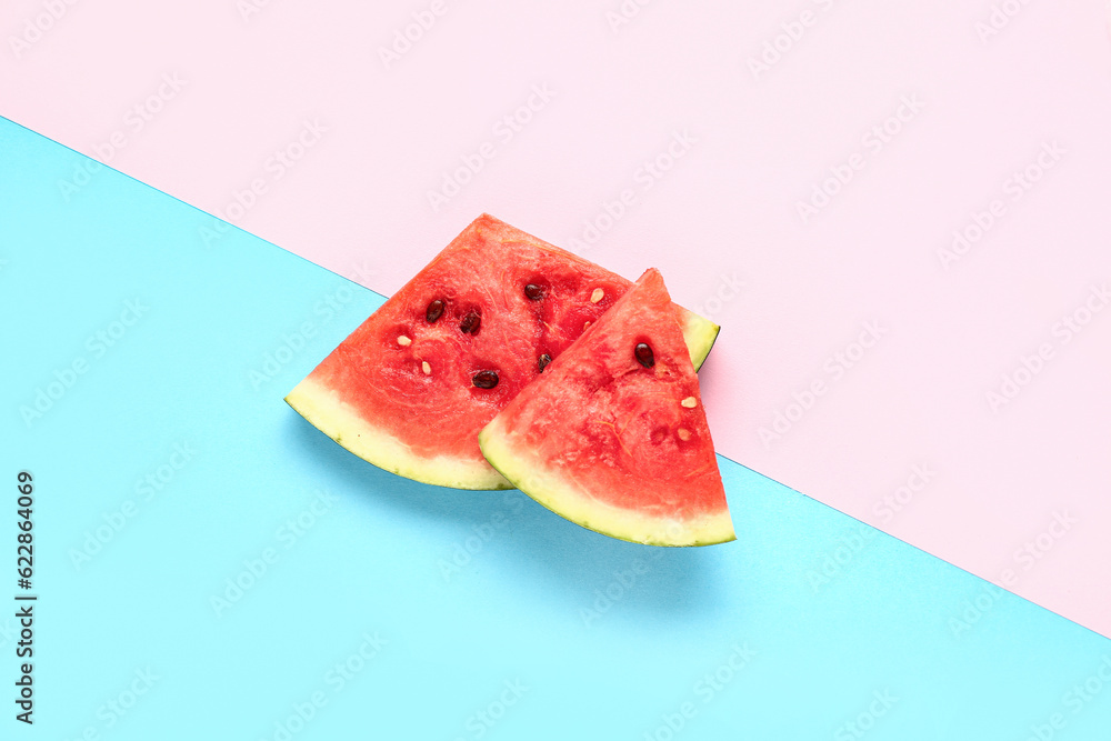 Pieces of fresh watermelon on colorful background