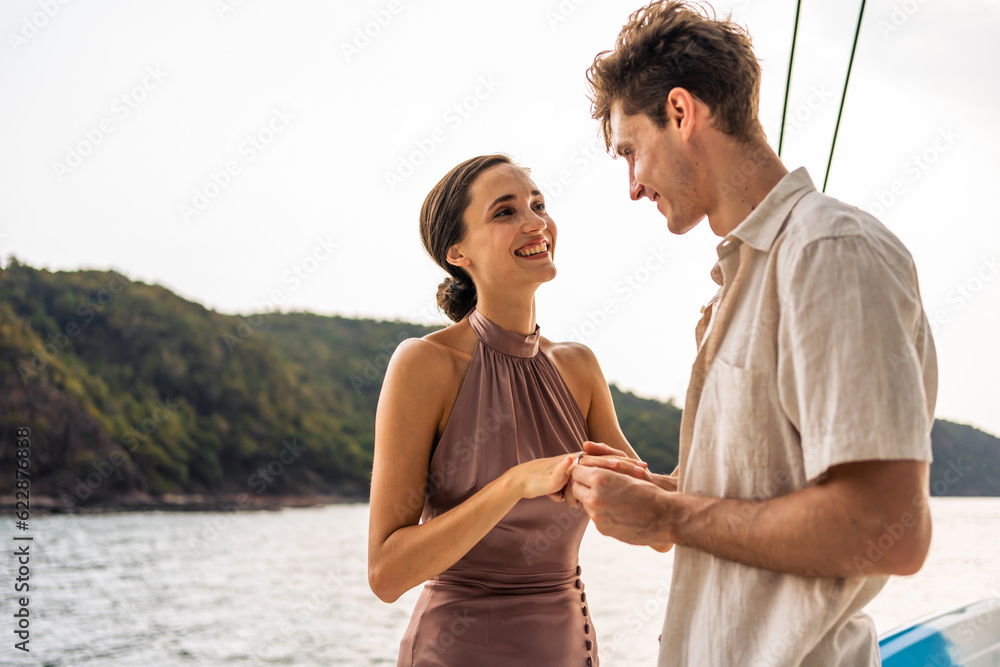 Caucasian young man make surprise proposal of marriage to girlfriend. 