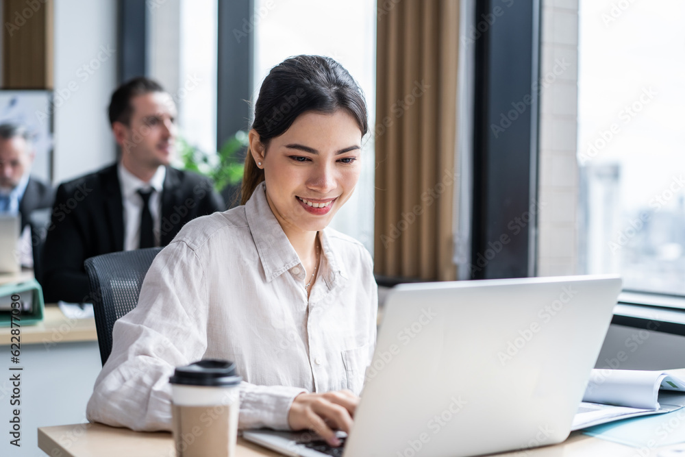 Asian beautiful businesswoman using laptop computer working in office. 