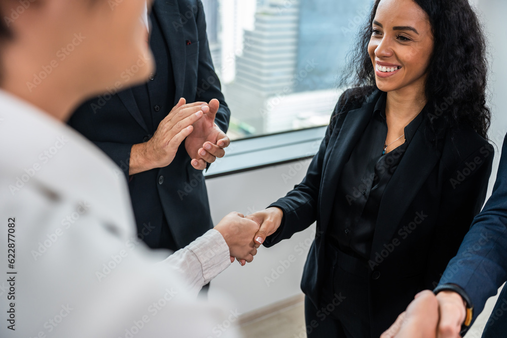 Multi-Ethnic young businessman making a handshake in the meeting room. 