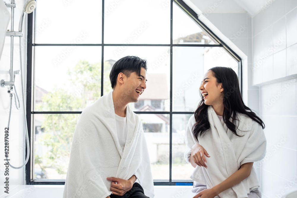 Asian new marriage couple spending time together in bathroom at home. 