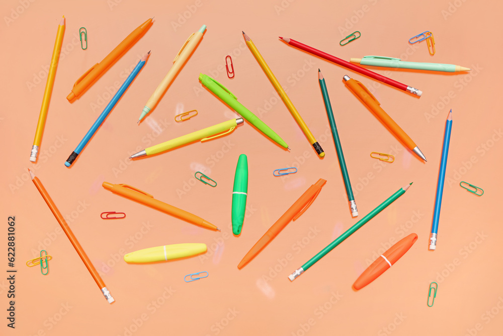 Different stationery on orange background