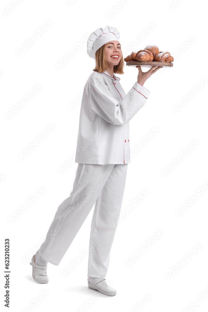 Female baker with board of tasty croissants on white background