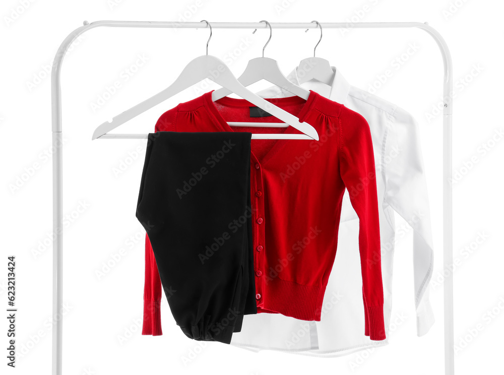 Rack with modern school uniform on white background