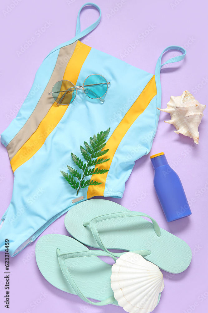 Composition with stylish swimsuit, flip-flops, sunglasses and bottle of sunscreen on color backgroun