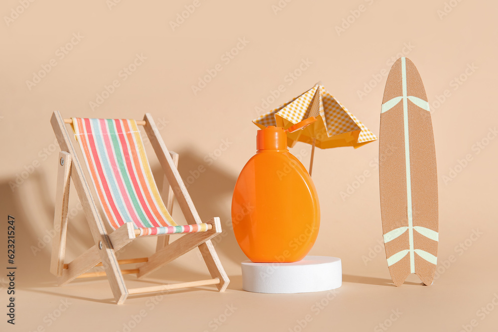 Composition with bottle of sunscreen cream and decor on color background