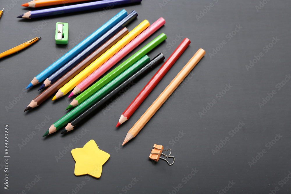 Calculator with different stationery on black chalkboard