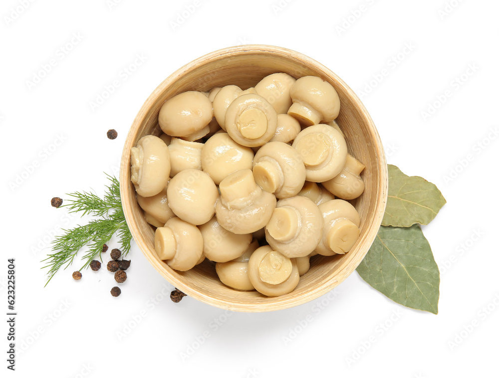 Bowl of canned mushrooms isolated on white background