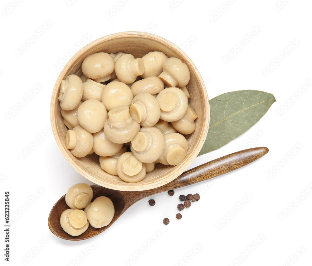 Bowl of canned mushrooms isolated on white background