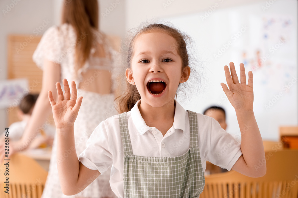 Cute little girl in art class