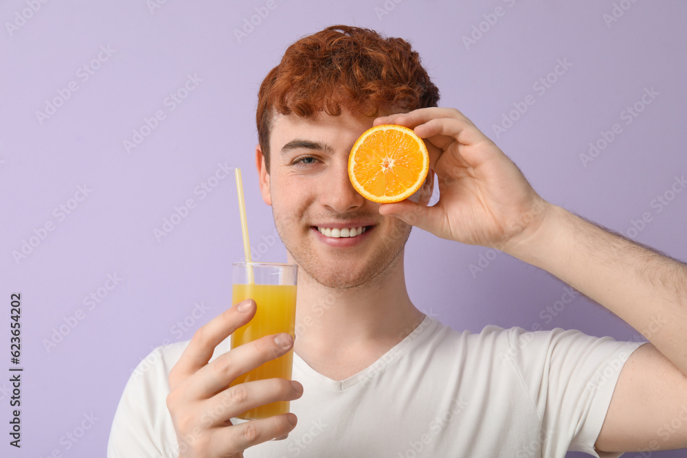 Young man with orange and glass of juice on lilac background, closeup