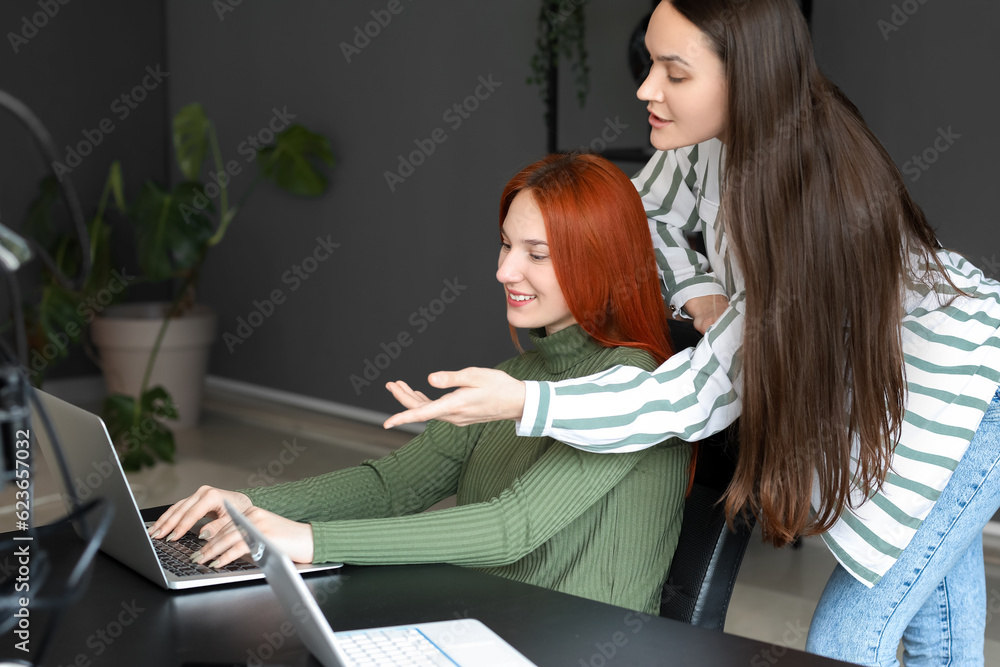 Female programmers working in office