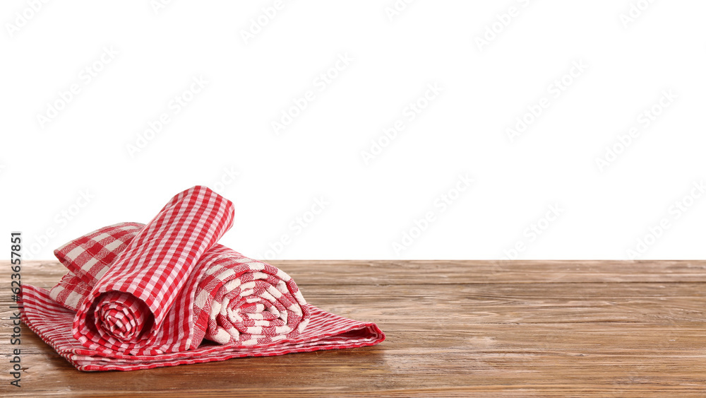 Clean napkins on wooden table against white background