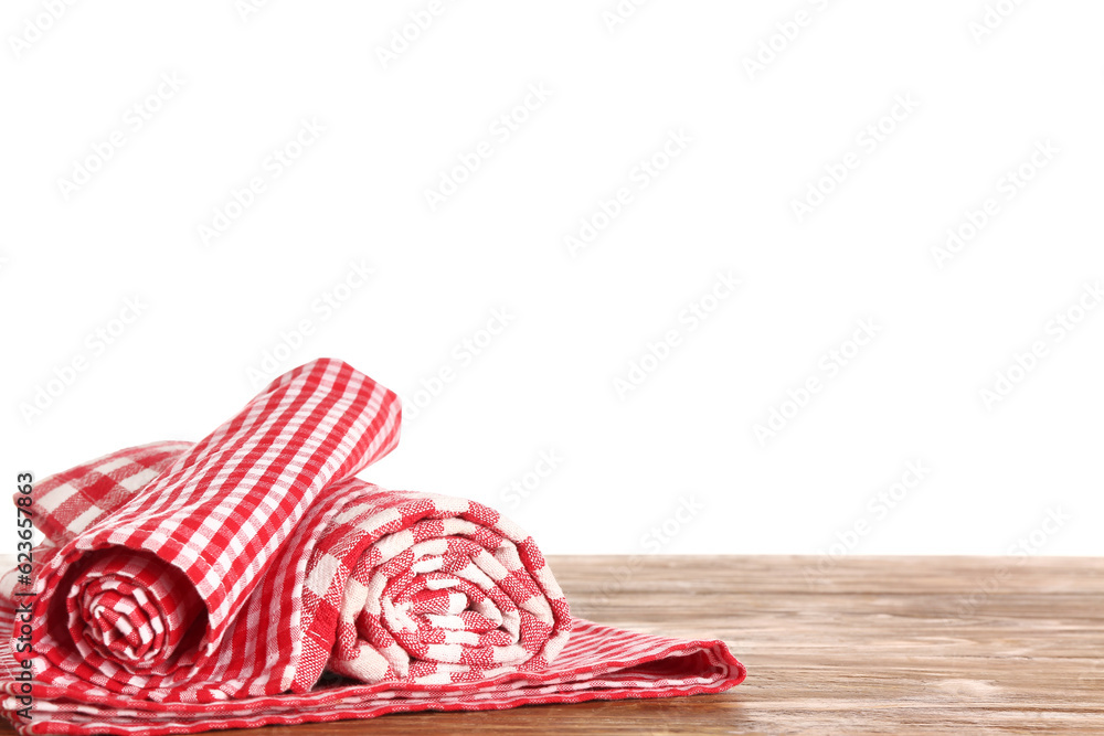 Clean napkins on wooden table against white background