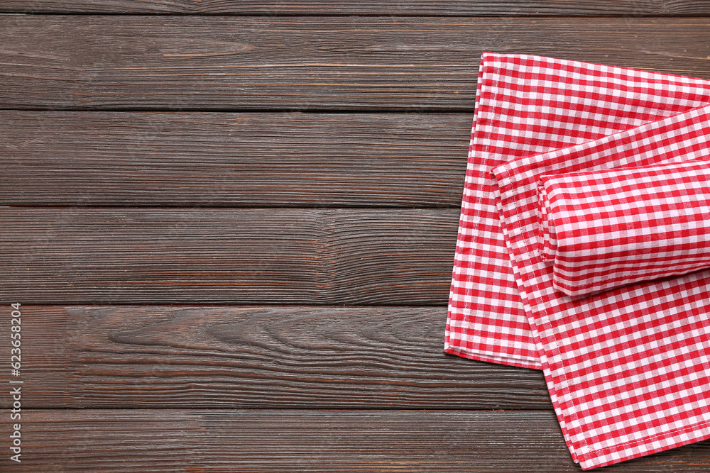 Set of clean napkins on dark wooden background