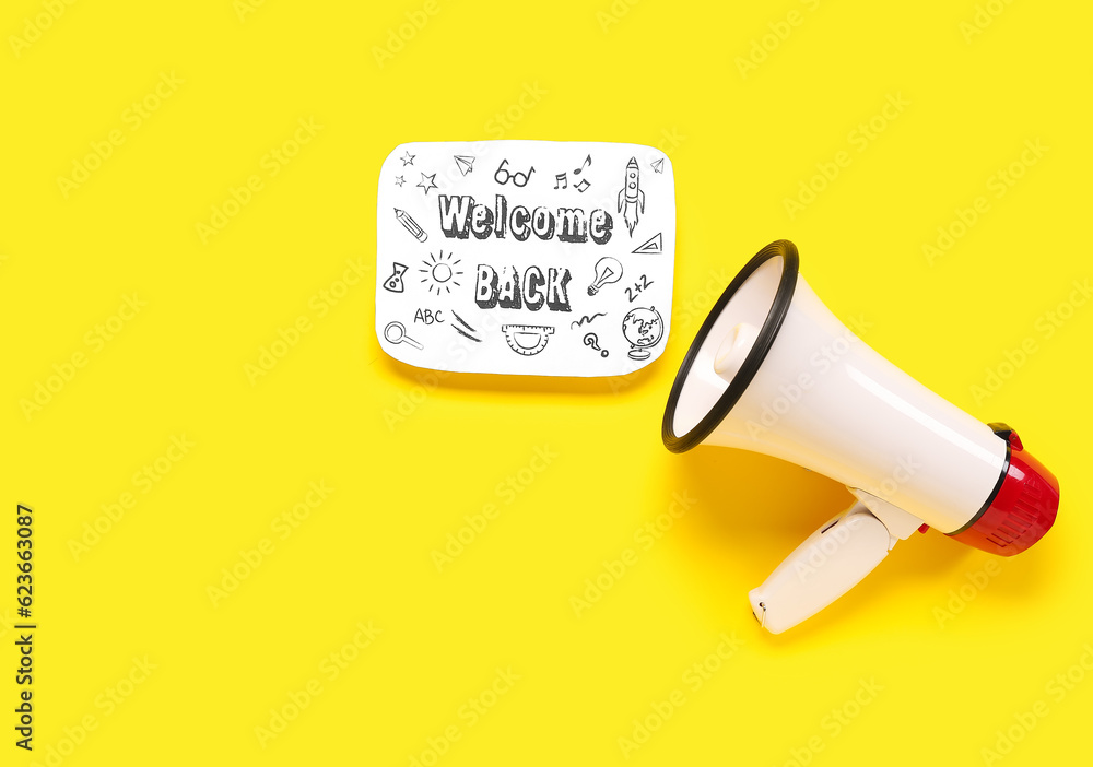 Megaphone and sheet with text WELCOME BACK on yellow background