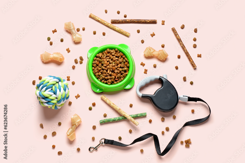 Composition with dog food and accessories on light background