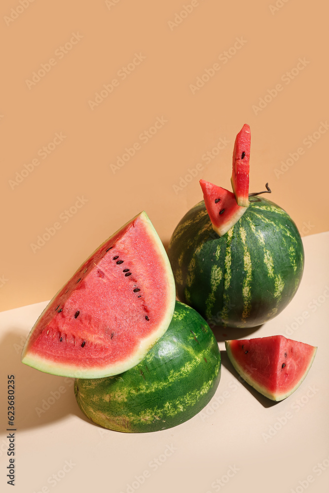 Fresh watermelons on beige table