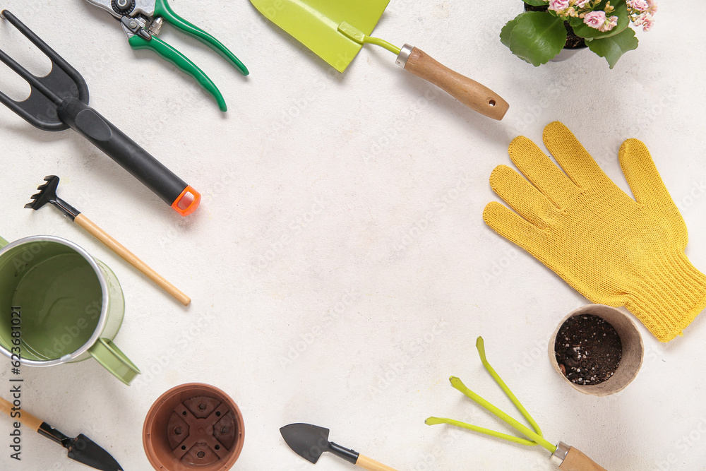 Frame made of different gardening tools on light background