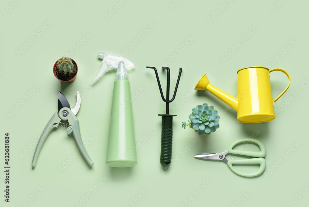 Set of gardening tools on green background