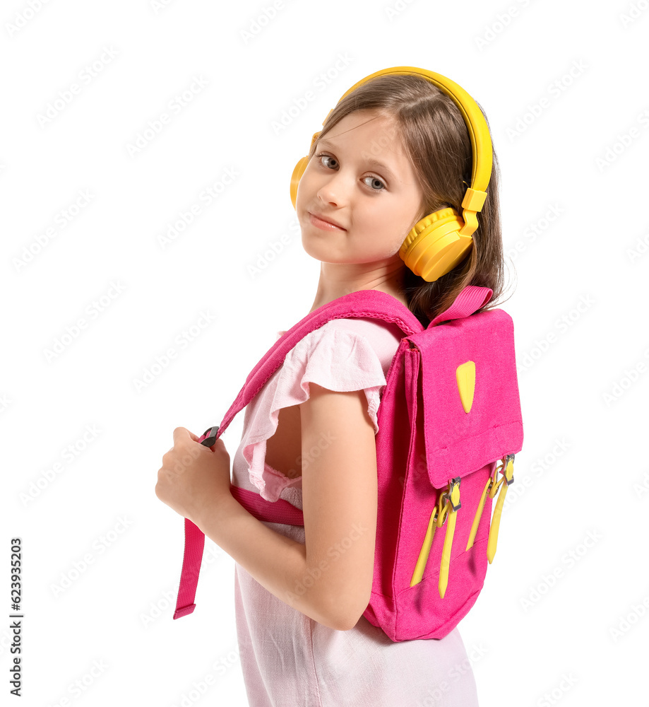 Little girl in headphones with backpack on white background