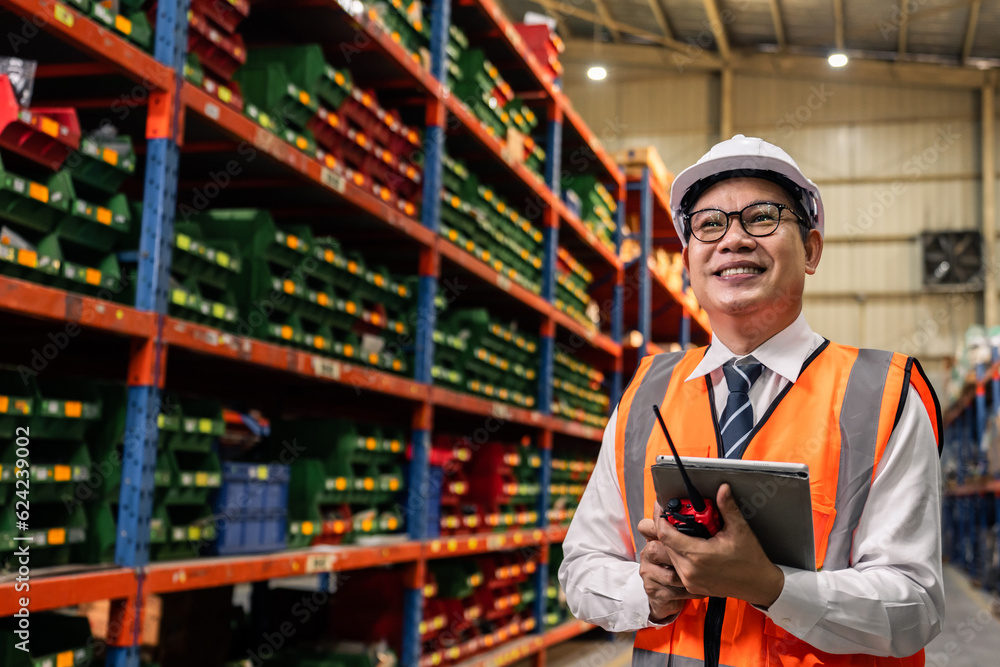 Asian attractive man industrial worker working in manufacturing plant. 