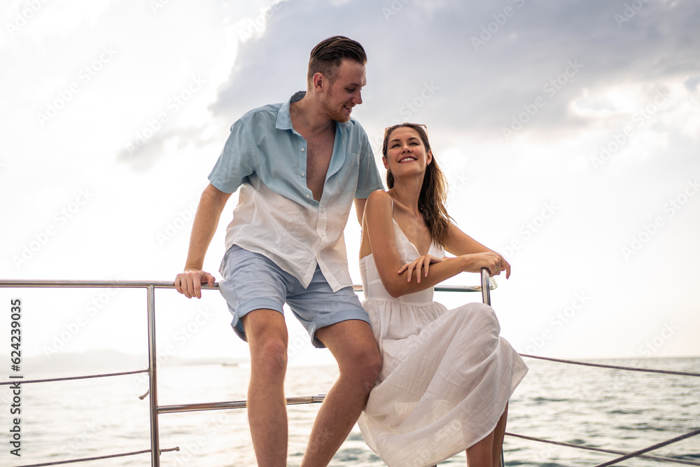 Caucasian romantic couple looking at beautiful view during yachting. 