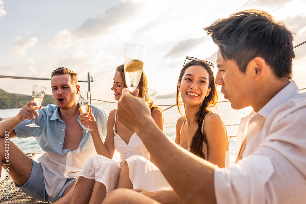 Group of diverse friends drink champagne while having a party in yacht.