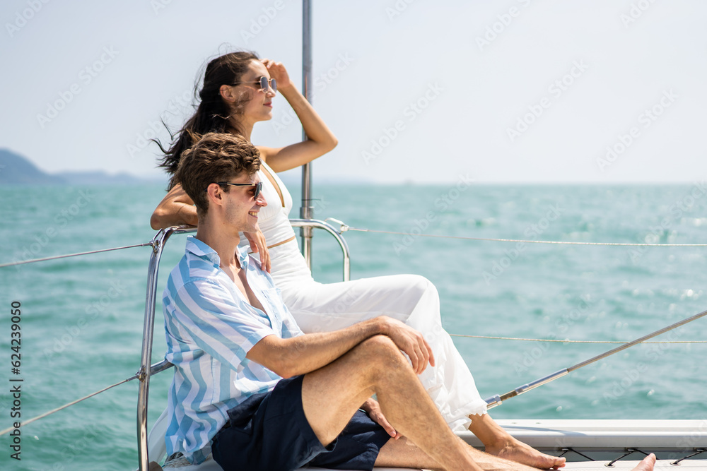 Caucasian romantic couple looking at beautiful view during yachting. 