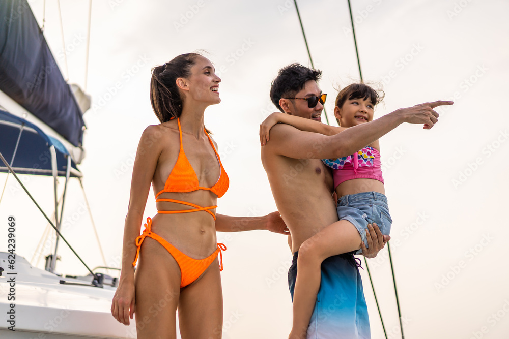 Caucasian happy family walking on deck of yacht while yachting outdoor. 