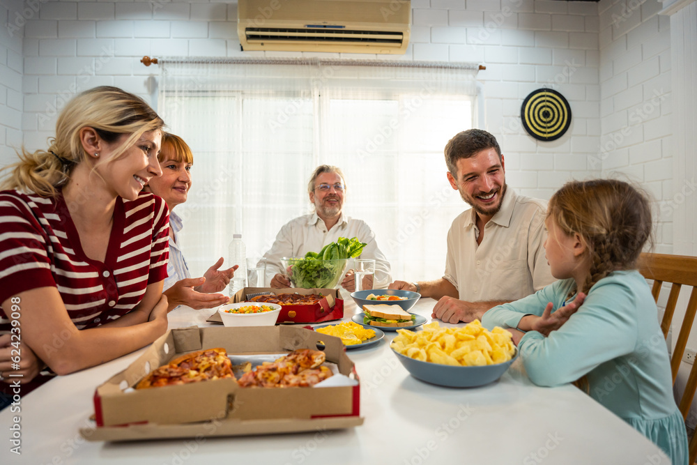 Caucasian lovely family having dinner, enjoying evening party in house. 