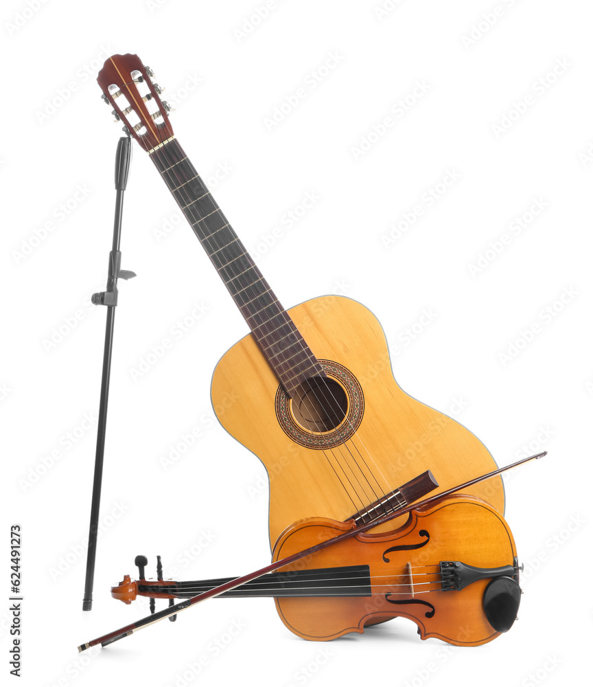 Guitar and violin on white background