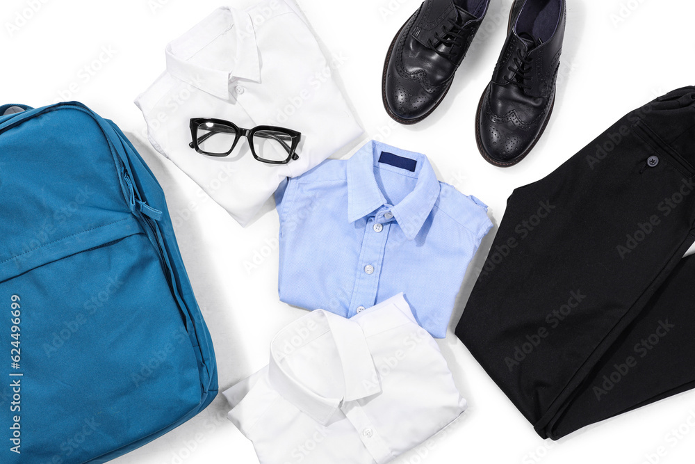 Composition with stylish school uniform, backpack, eyeglasses and shoes on white background, closeup