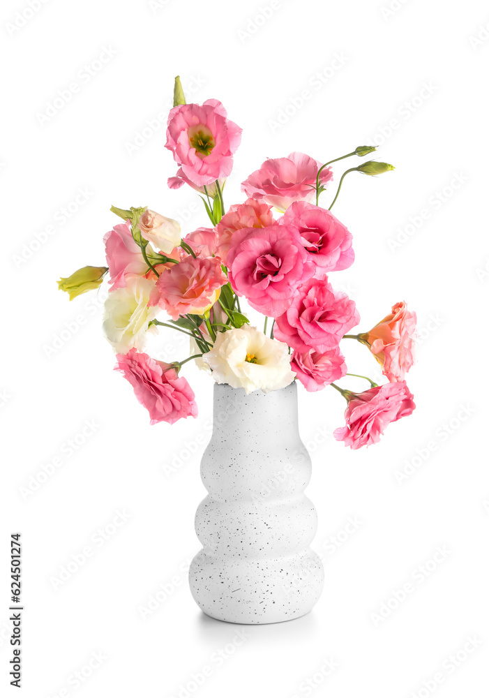 Vase with beautiful pink eustoma flowers on white background