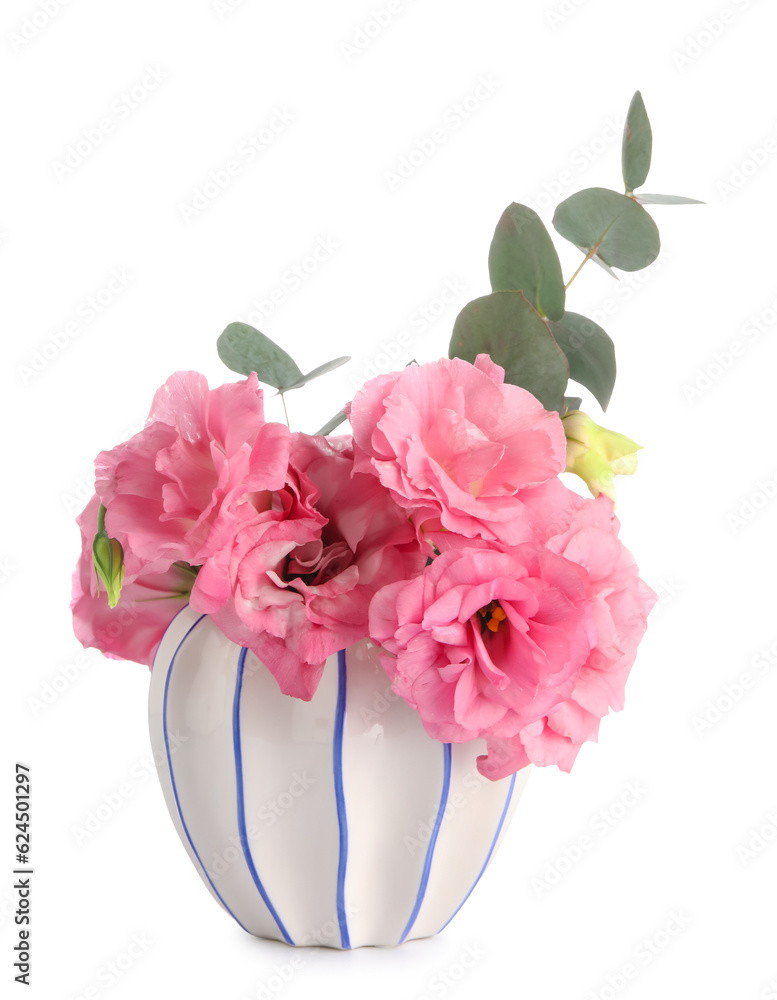 Vase with beautiful pink eustoma flowers on white background