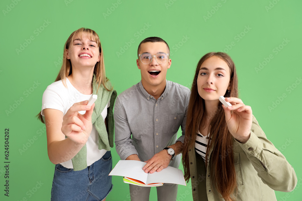 Teenage students on green background