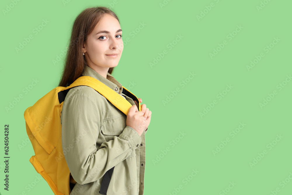 Female student on green background