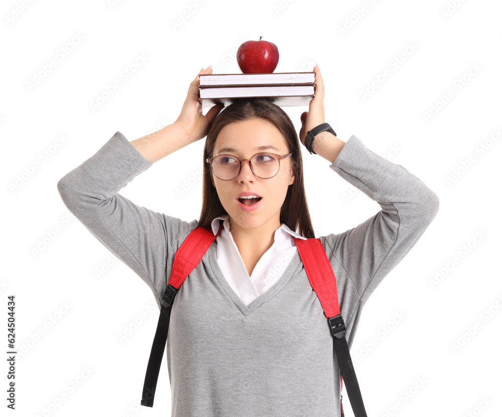 Female student with apple and books on white background