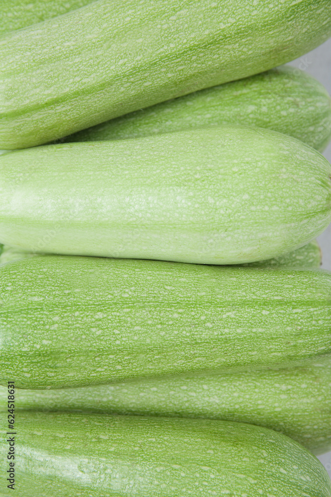 Fresh green zucchini as background