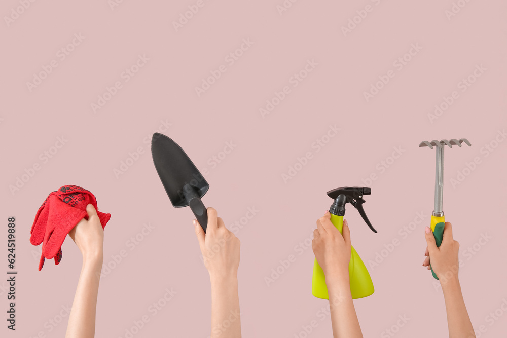 Women with different gardening tools on pink background